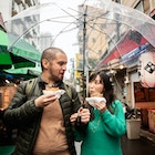 An internationally married couple who came to Tsukiji for sightseeing while eating fried food 