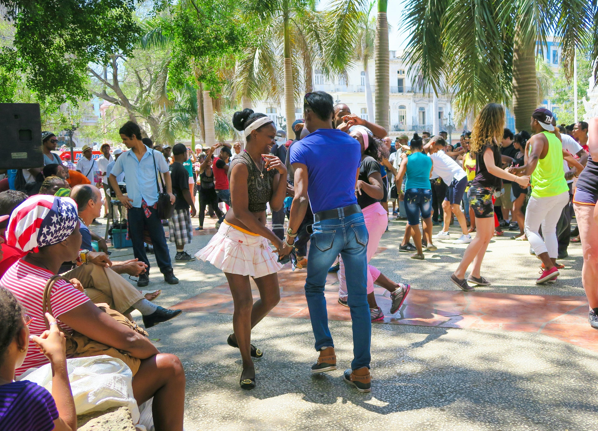 People salsa-dancing in the street near one of Havana's central squares
